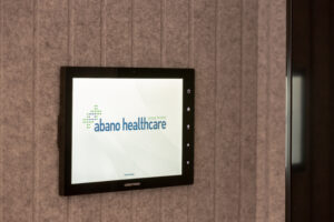 Abano Healthcare crestron room booking control system