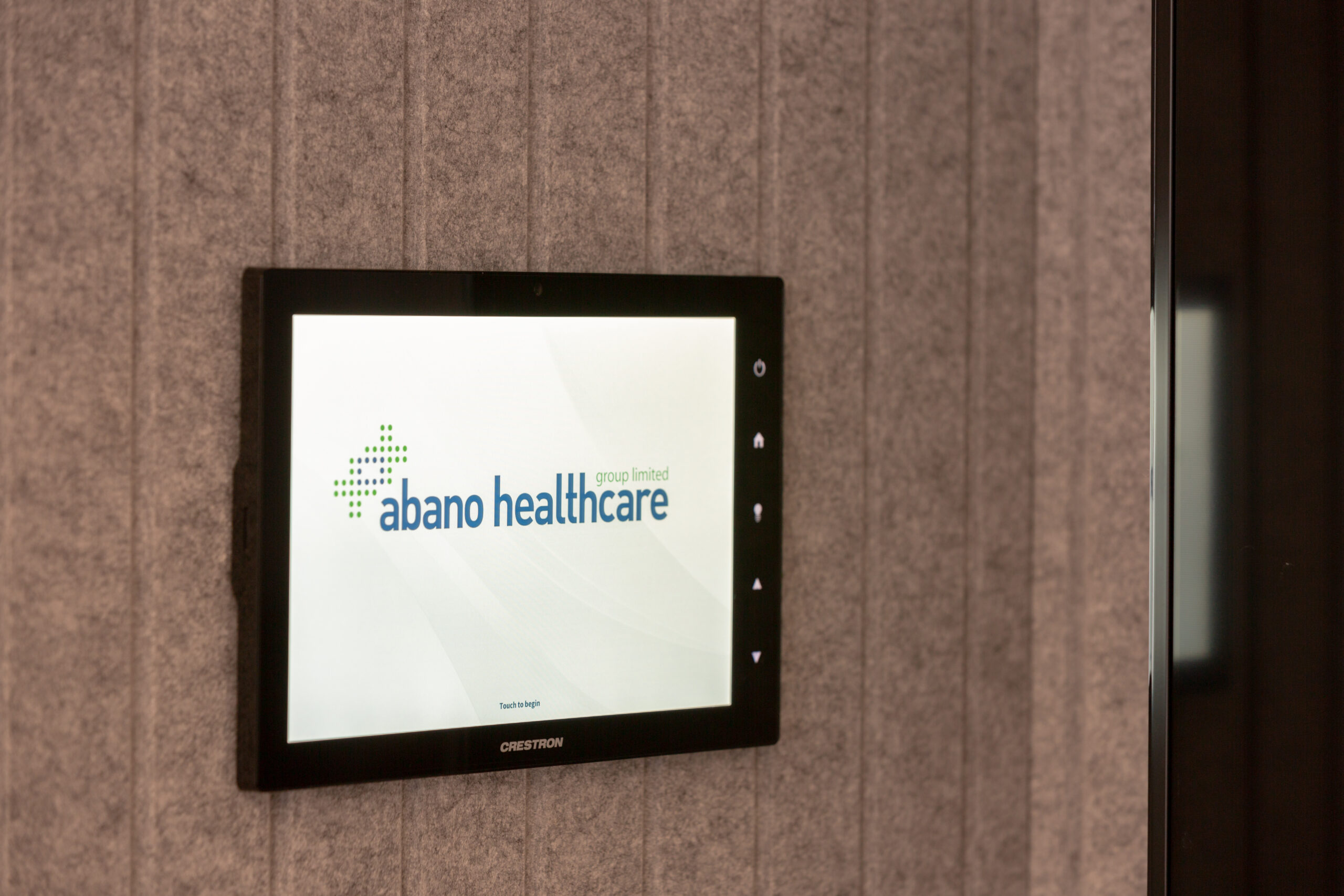 Abano Healthcare crestron room booking control system